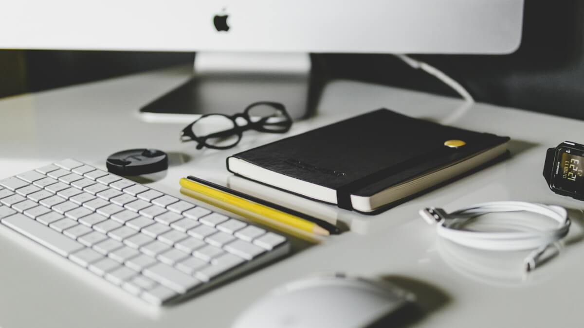 Apple Magic Keyboard and Apple Magic Mouse on white table