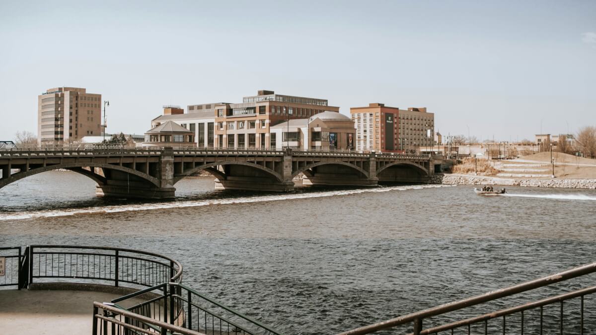 white and brown concrete bridge over river during daytime